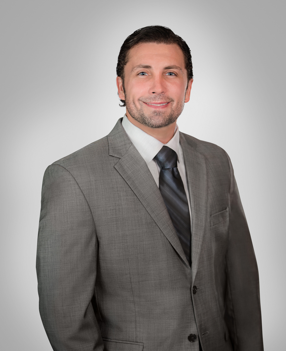 Modern head shot with gray background. Palm Beach Gardens.